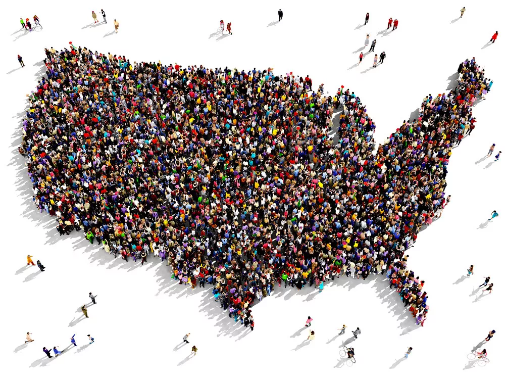 An aerial view of a group of people standing in the shape of the United States.
